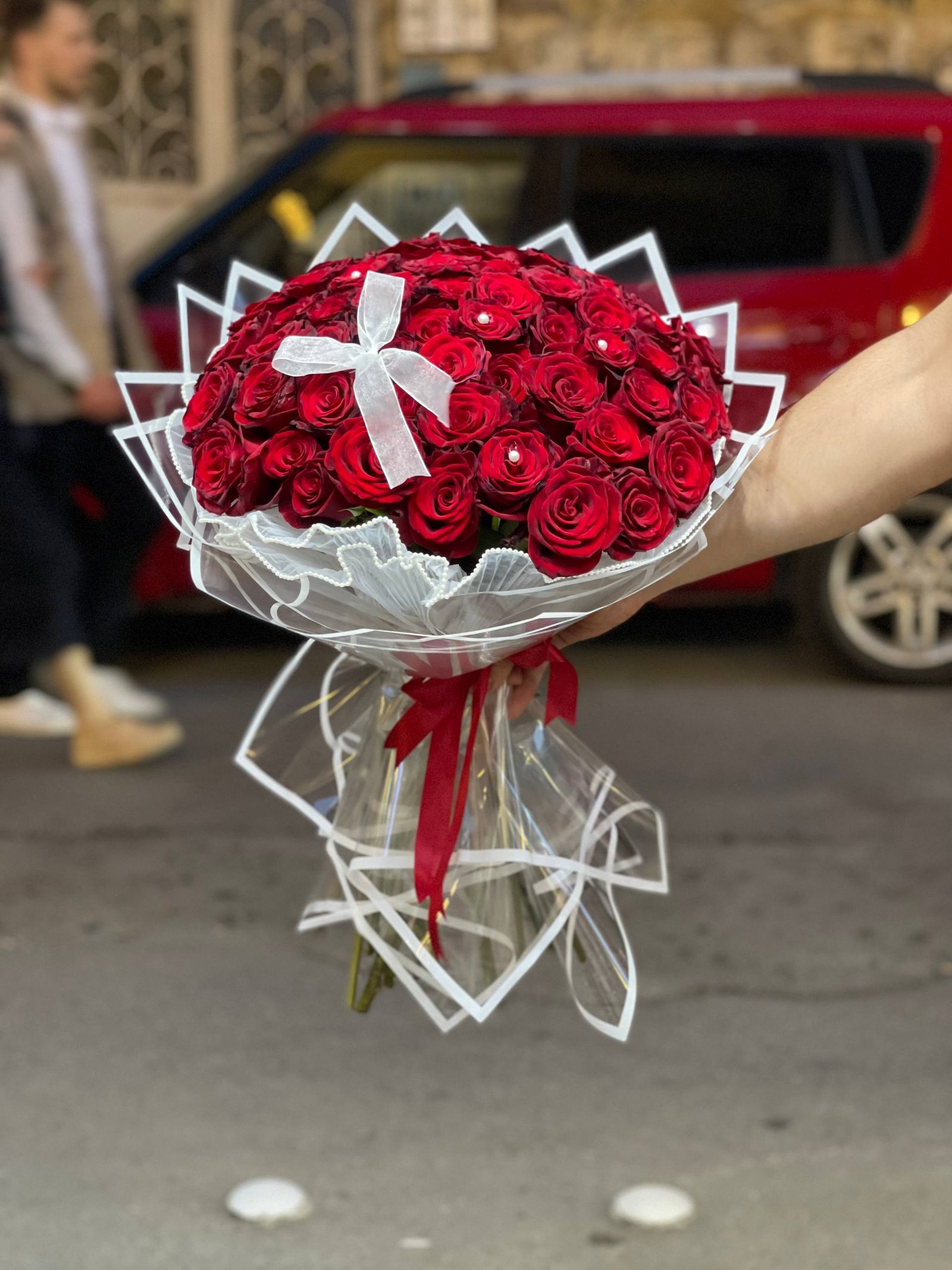 باقة جوري تغليف شفاف مع ريبون